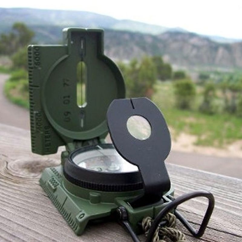 Cammenga Compass - Military Grade navigation tool displayed outdoors with custom kit builds A Way Through the Wilderness