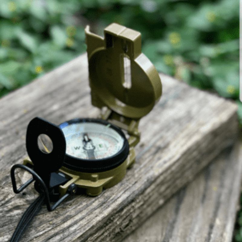 Cammenga Compass - Military Grade on weathered wood, rugged navigation with custom kit builds and expert service A Way Through the Wilderness