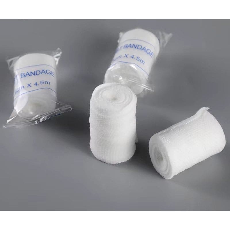 White bandages with packaging on a gray background