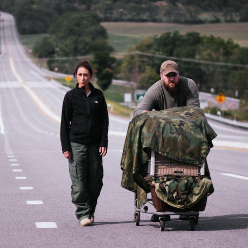 Survival Bug Out DVD or USB showing two people with camo gear on roadside featuring custom kit builds and service A Way Through the Wilderness