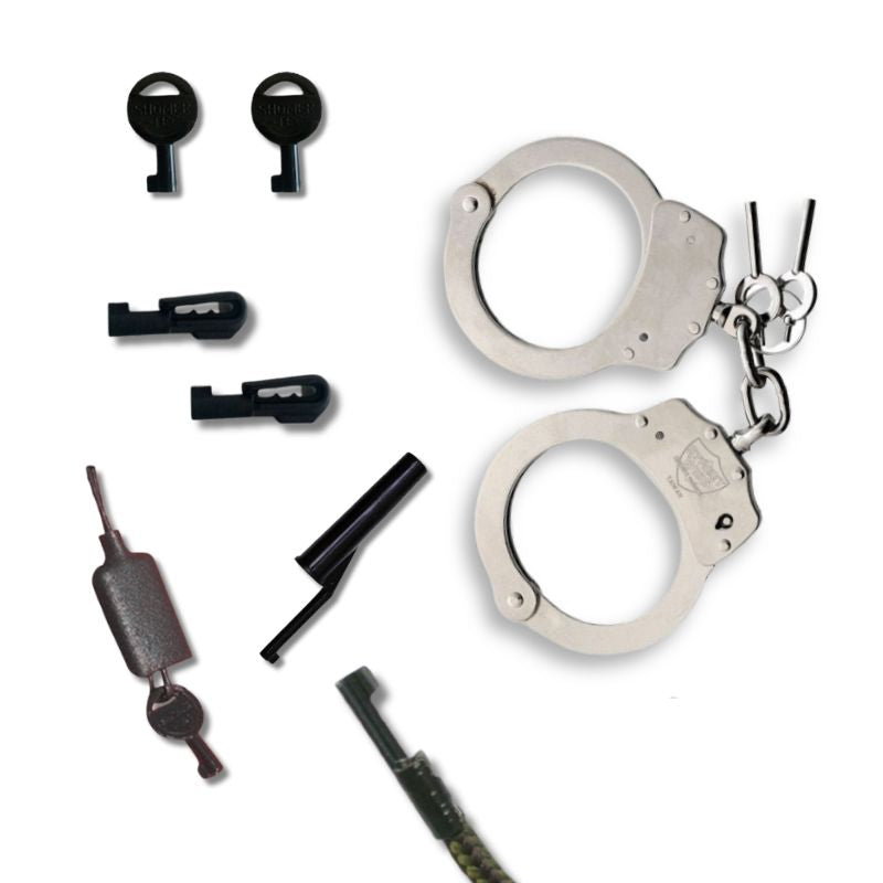 Set of handcuffs and keys on a white background