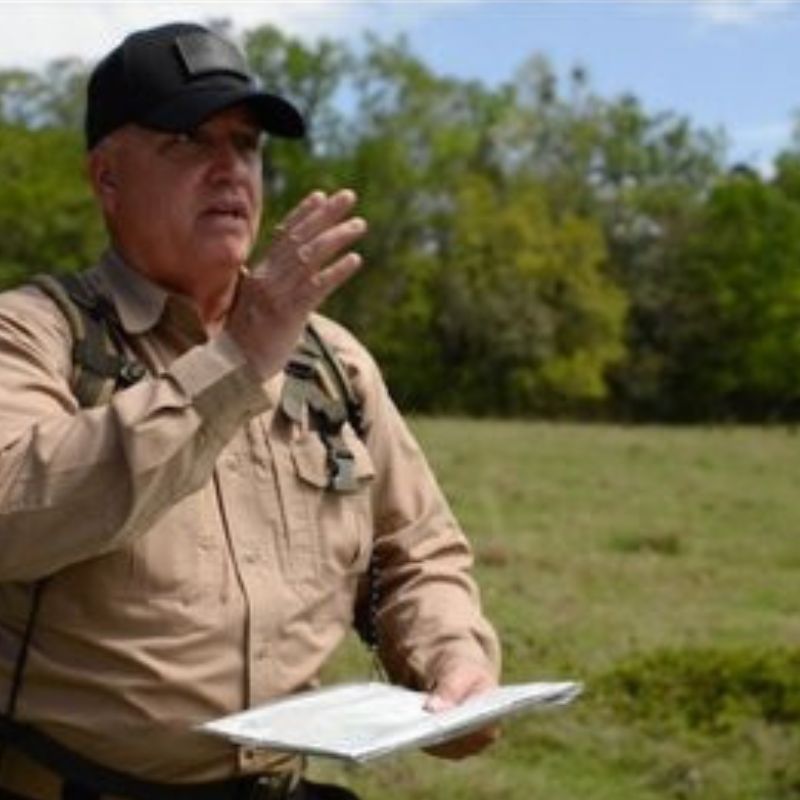 Land Navigation DVD or USB showing man instructing outdoors with map and compass, featuring custom kit builds A Way Through the Wilderness